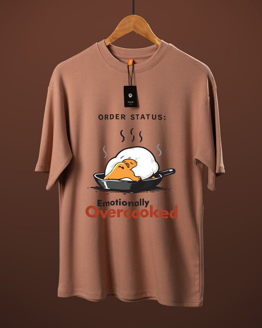 DUMM Emotionally Overcooked oversized t-shirt in dusty rose on wooden hanger