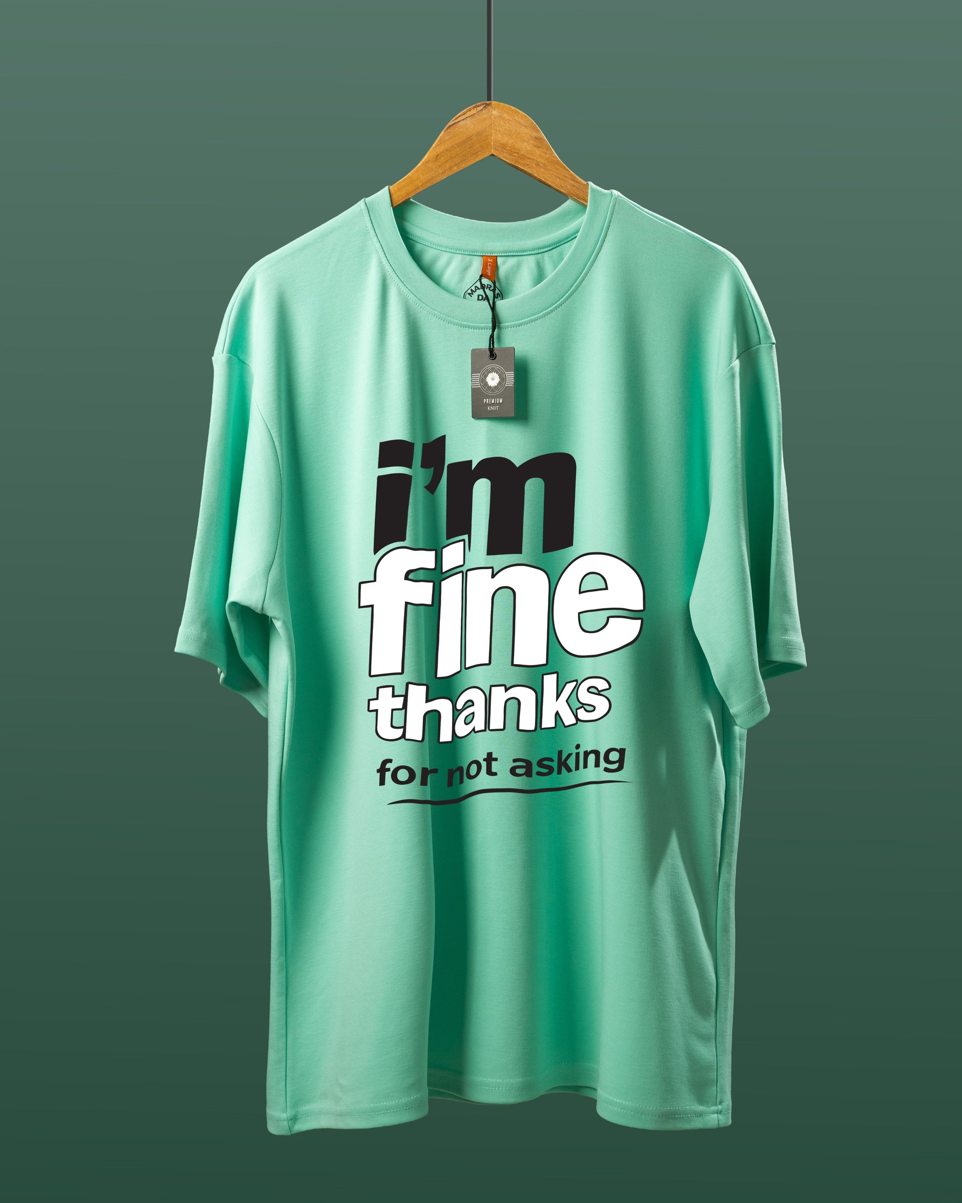 DUMM I'm Fine Thanks For Not Asking oversized t-shirt in mint green on wooden hanger