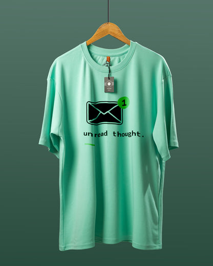 DUMM Unread Thought oversized t-shirt in mint green on wooden hanger