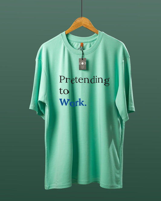 DUMM Pretending To Work oversized t-shirt in mint green on wooden hanger