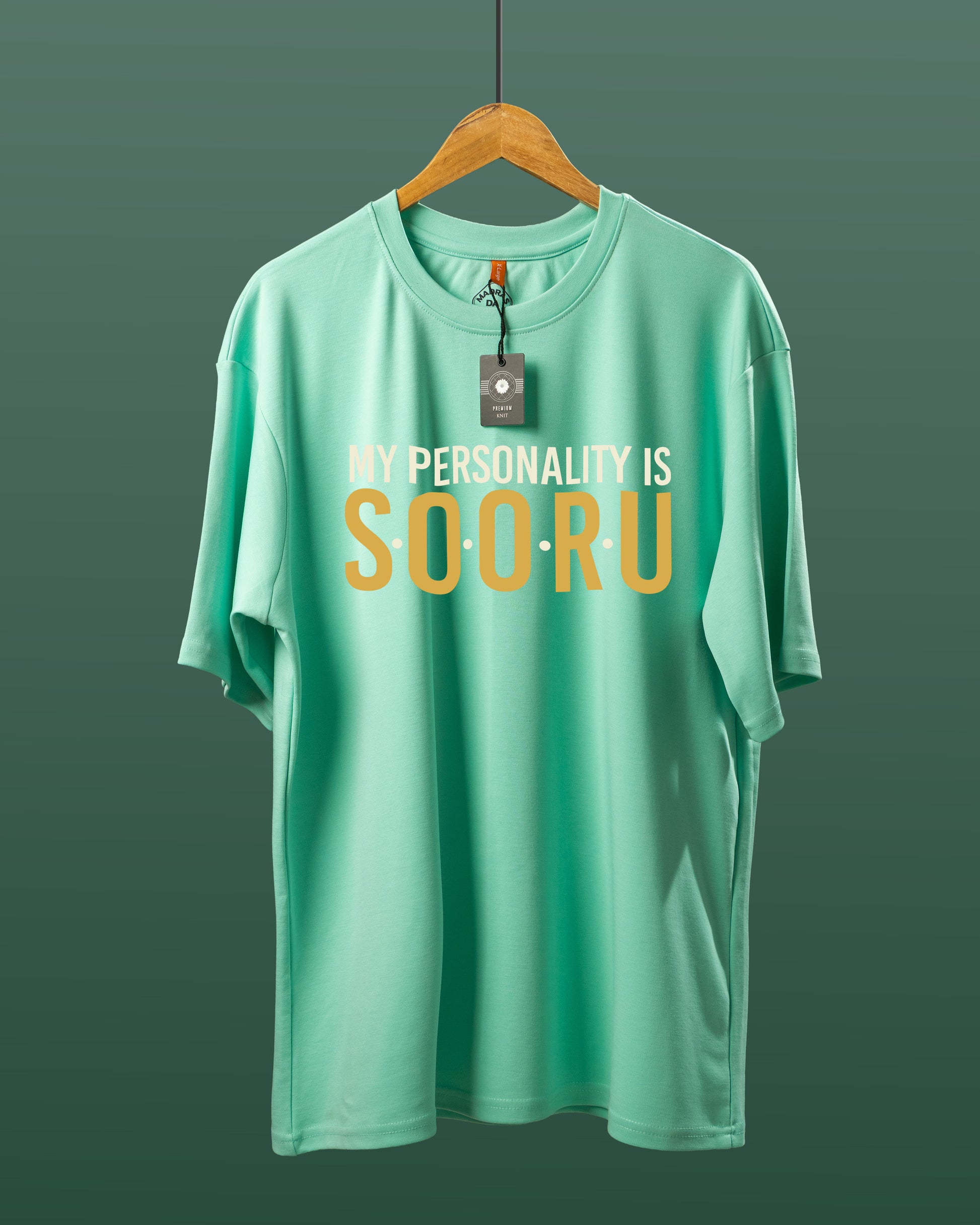 DUMM My Personality Is Sooru oversized t-shirt in mint green on wooden hanger