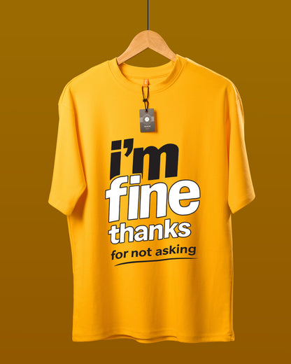 DUMM I'm Fine Thanks For Not Asking oversized t-shirt in mustard yellow on wooden hanger