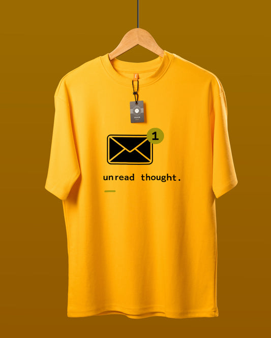 DUMM Unread Thought oversized t-shirt in mustard yellow on wooden hanger