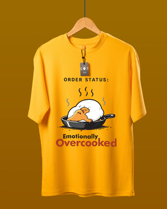 DUMM Emotionally Overcooked oversized t-shirt in mustard yellow on wooden hanger