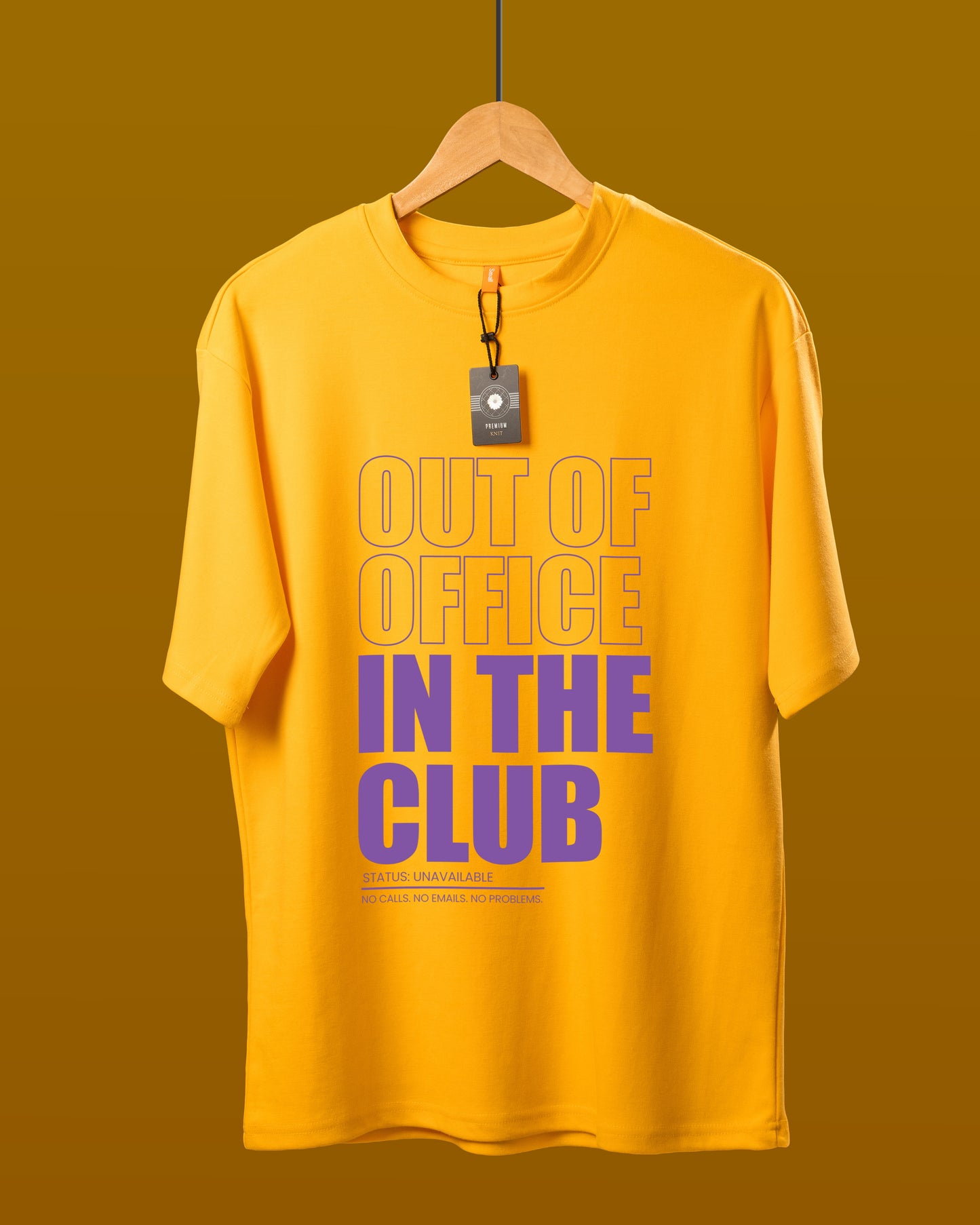 DUMM Out Of Office In The Club oversized t-shirt in mustard yellow on wooden hanger