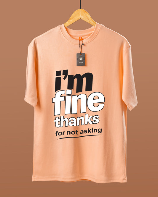 DUMM I'm Fine Thanks For Not Asking oversized t-shirt in peach on wooden hanger