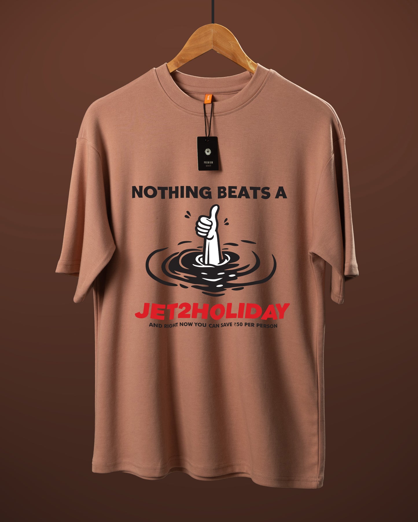 DUMM Nothing Beats A Holiday oversized t-shirt in dusty rose on wooden hanger