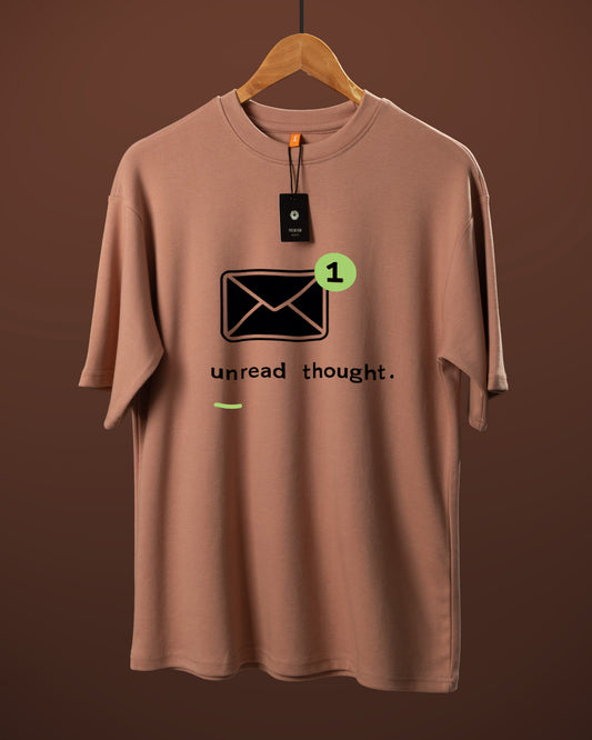 DUMM Unread Thought oversized t-shirt in dusty rose on wooden hanger