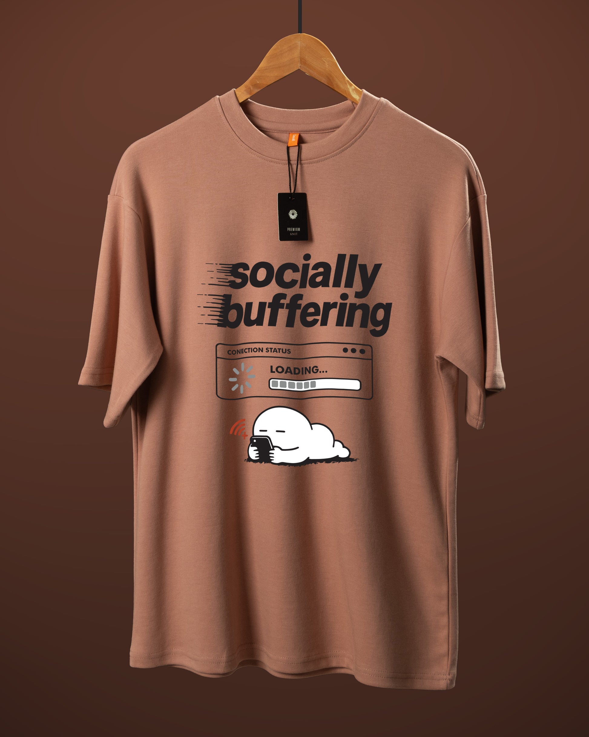 DUMM Socially Buffering oversized t-shirt in dusty rose on wooden hanger
