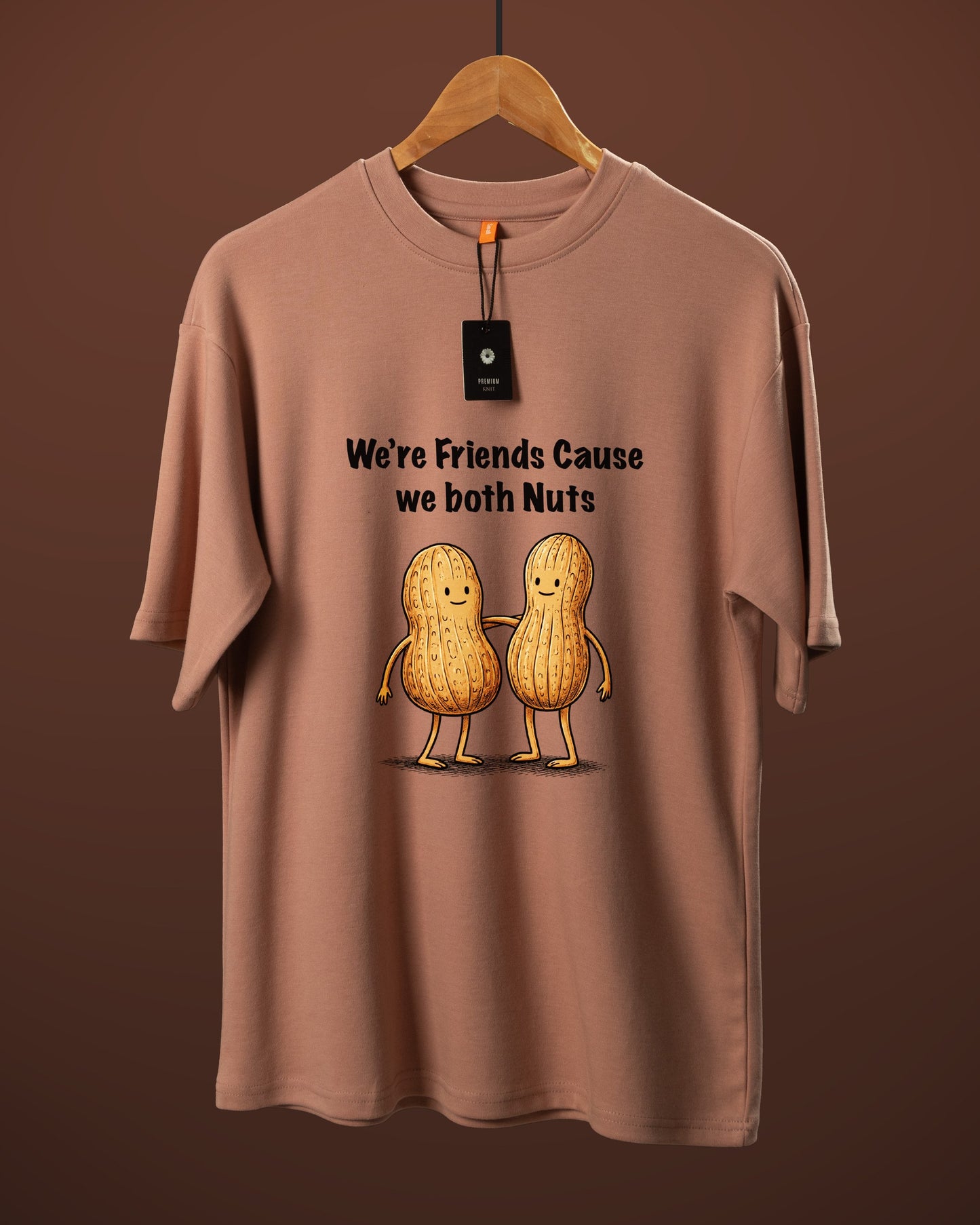 DUMM We're Friends Cause We Both Nuts oversized t-shirt in dusty rose on wooden hanger