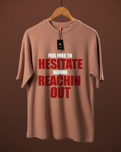 DUMM Feel Free To Hesitate Before Reachin Out oversized t-shirt in dusty rose on wooden hanger