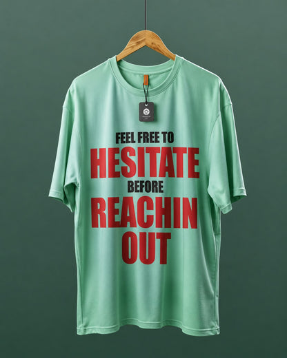 DUMM Feel Free To Hesitate Before Reachin Out oversized t-shirt in mint green on wooden hanger