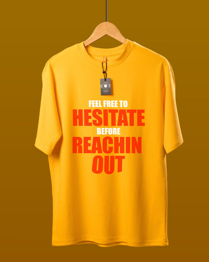 DUMM Feel Free To Hesitate Before Reachin Out oversized t-shirt in mustard yellow on wooden hanger