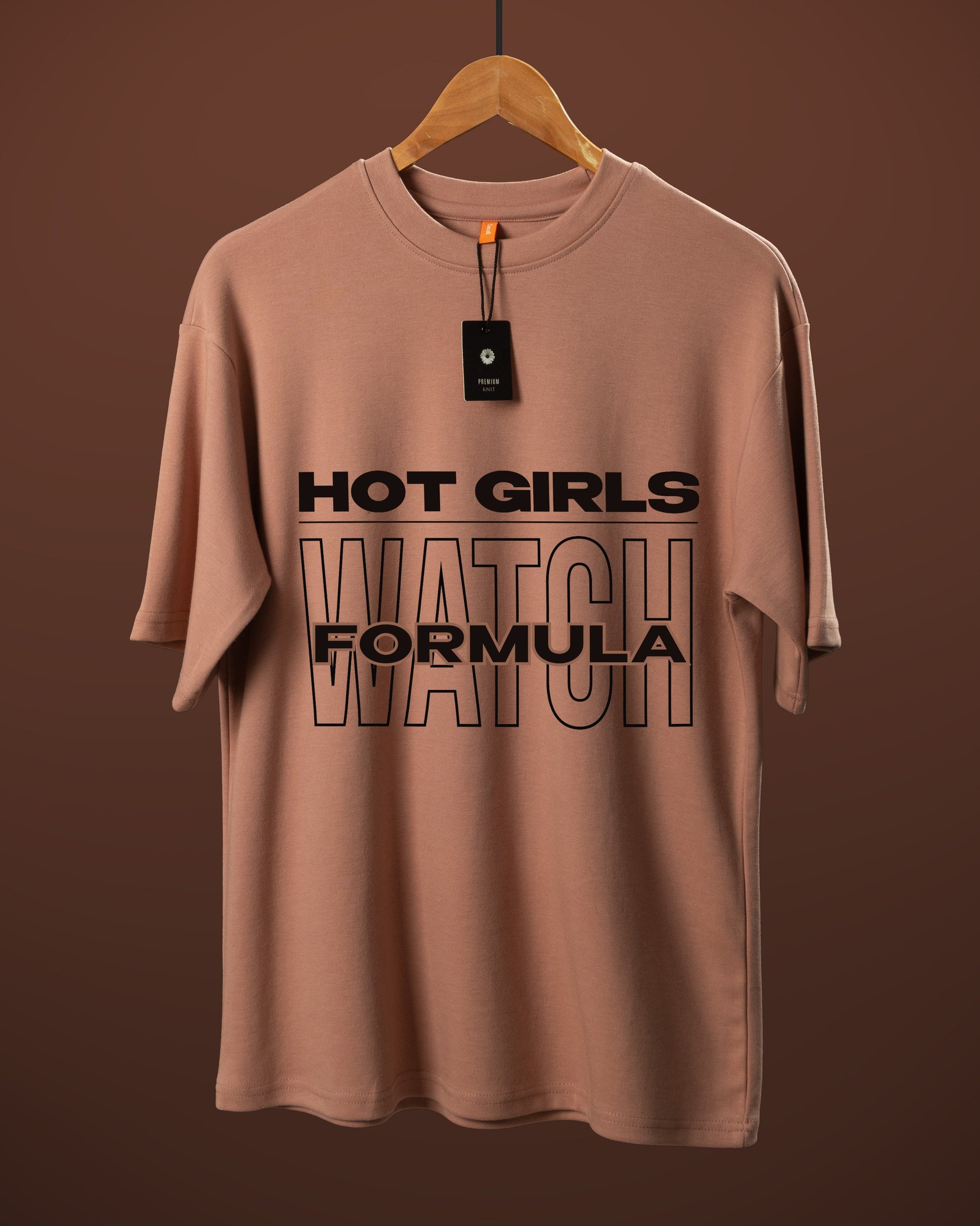 DUMM Hot Girls Watch Formula oversized t-shirt in dusty rose on wooden hanger