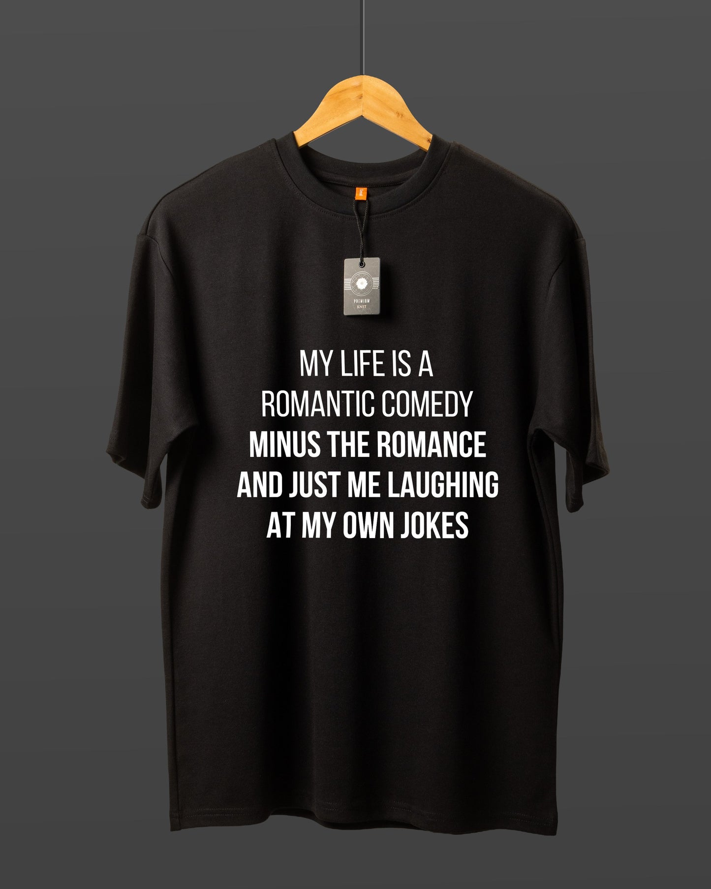 DUMM Romantic Comedy Minus The Romance oversized t-shirt in black on wooden hanger